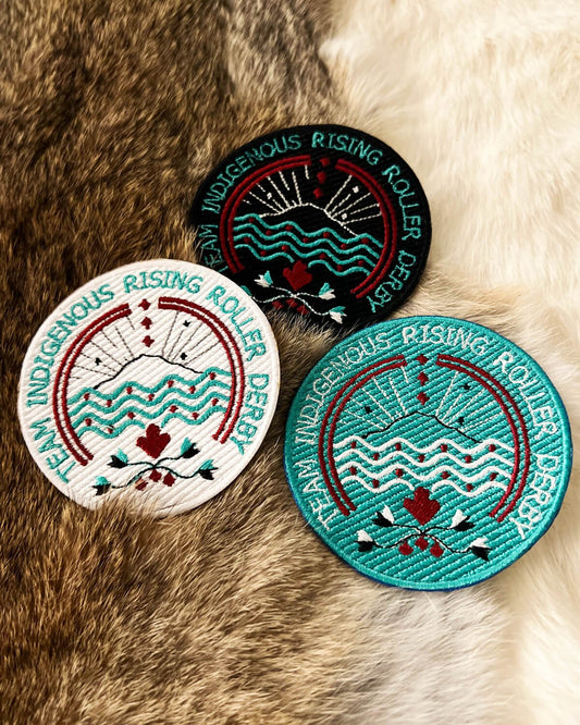 Team Indigenous Rising Roller Derby, iron-on 3" round embroidered patch applique; white, black and teal